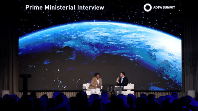 H.E. Mia Amor Mottley, Prime Minister of Barbados, in conversation with Nigel Topping, Former UN High Level Climate Champion, at the Abu Dhabi Sustainability Week Summit. 